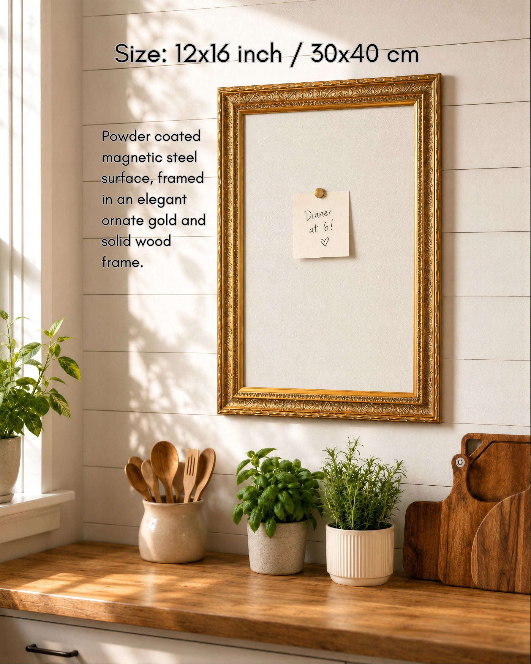 12x16 gold framed magnetic board with a pinned note, styled in a warm sunlit kitchen with plants, wood accents, and natural home decor.