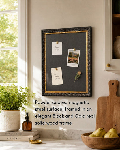 This 14x18 black and gold magnetic board features a powder coated magnetic steel surface and solid wood frame styled in a bright kitchen with notes, photos, and decorative magnets.