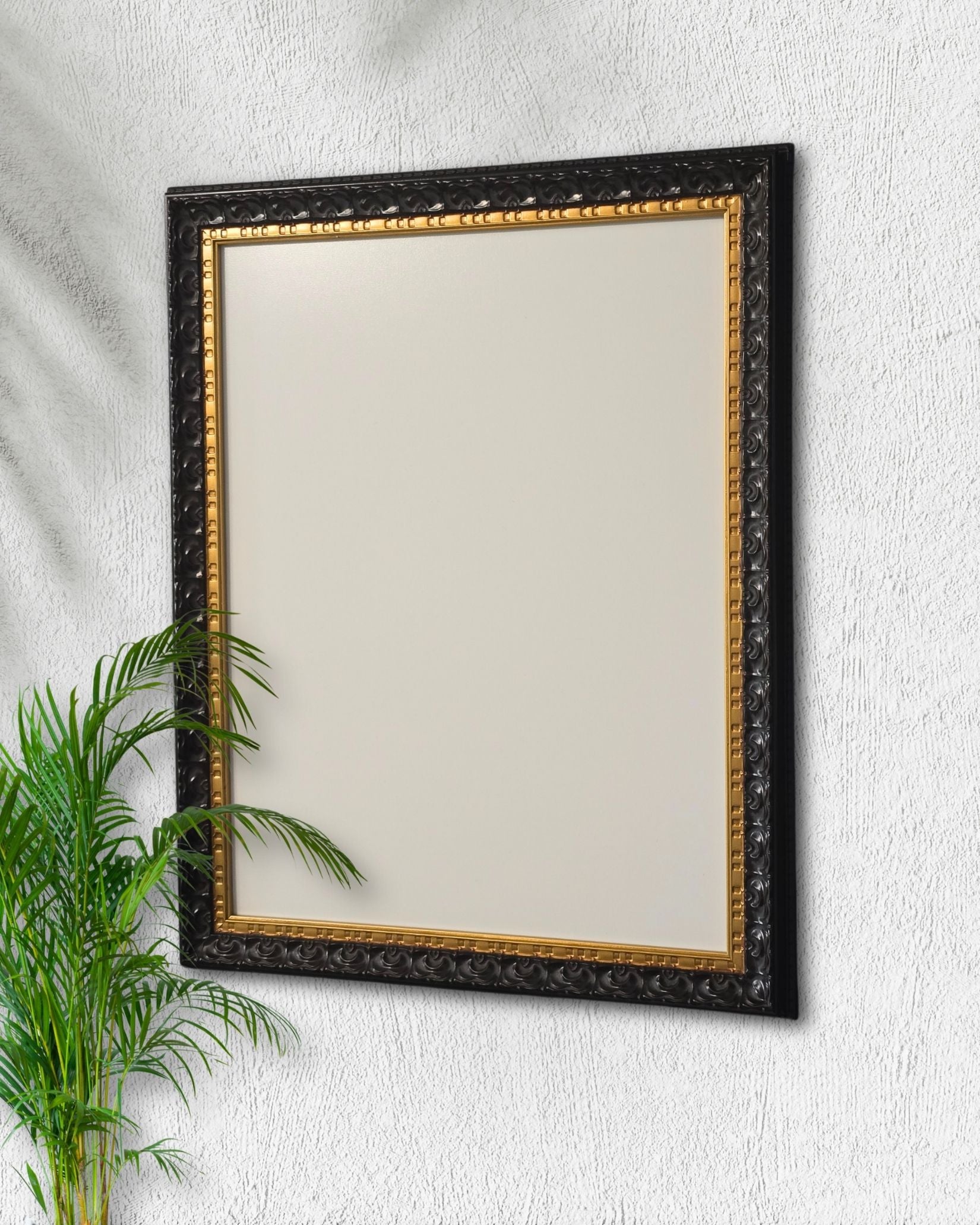 This 14x18 black and gold magnetic board features a vintage solid wood frame with a magnetic steel surface displayed on a textured white wall beside a green plant.