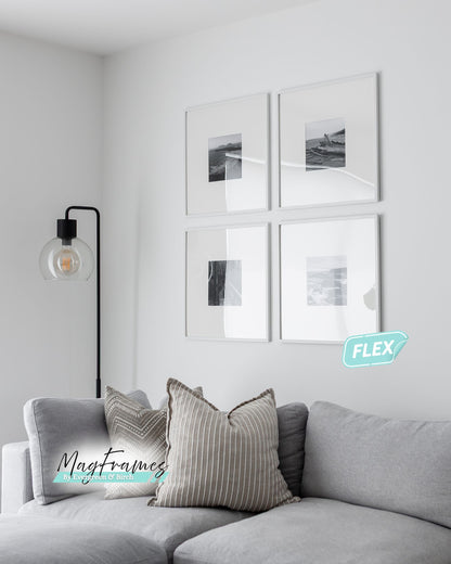 20x20 white MagFrames Flex interchangeable picture frames displaying black and white artwork in a minimalist living room.
