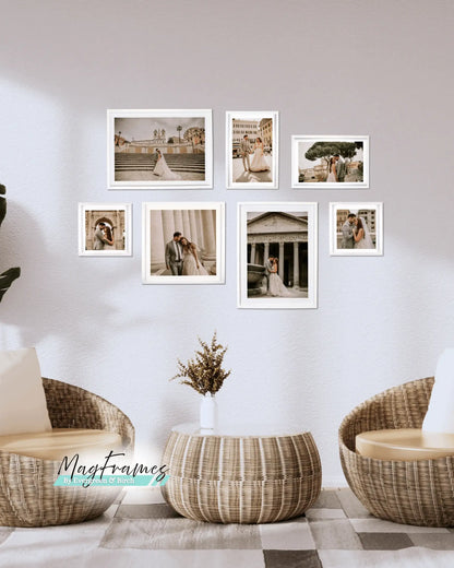 The Meadow 7-piece magnetic gallery wall set with white photo frames displayed in a modern living room.