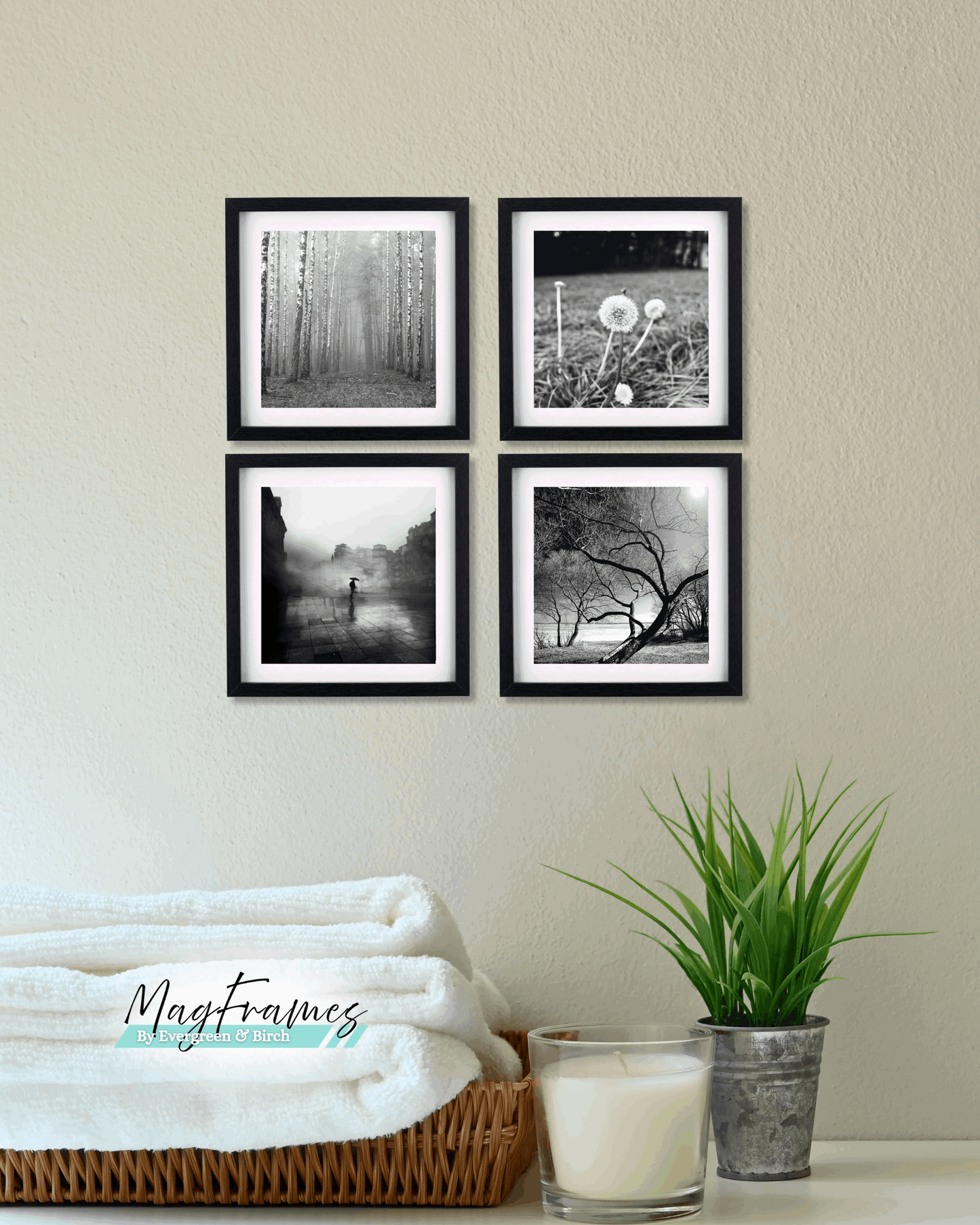 8x8 black magnetic peel and stick photo frames arranged as a square gallery wall set of 4 above a shelf with plant decor.