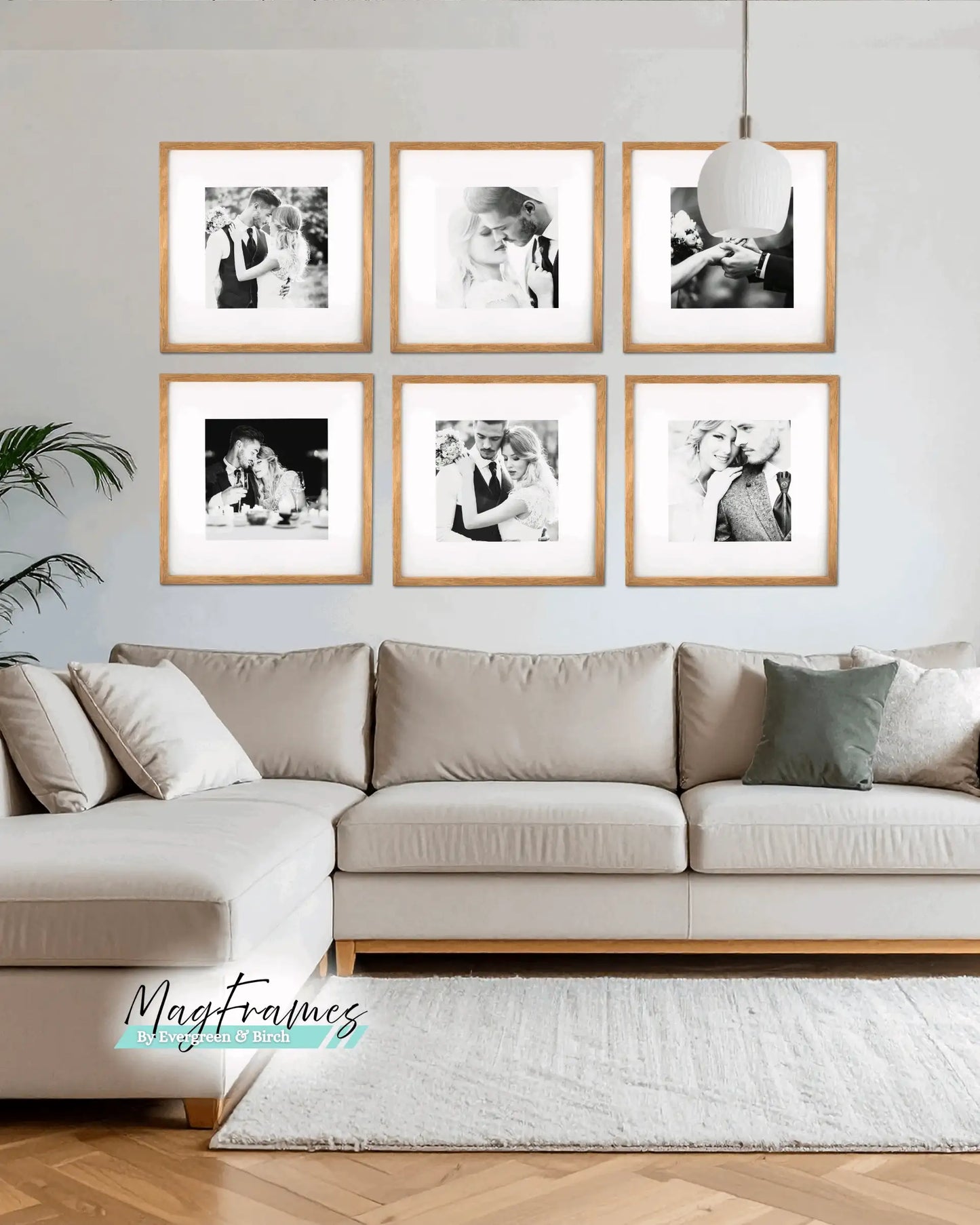 Natural oak MagFrames magnetic photo frames arranged in a 20x20 gallery wall above a beige sofa in a modern Scandinavian living room.