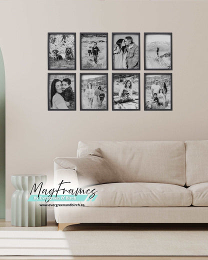 Living room gallery wall featuring black magnetic photo frames displaying black and white family photos above a sofa.