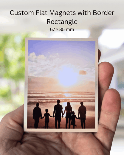 Custom rectangle photo magnet with coloured border, 67x85mm size, held in hand to show scale.