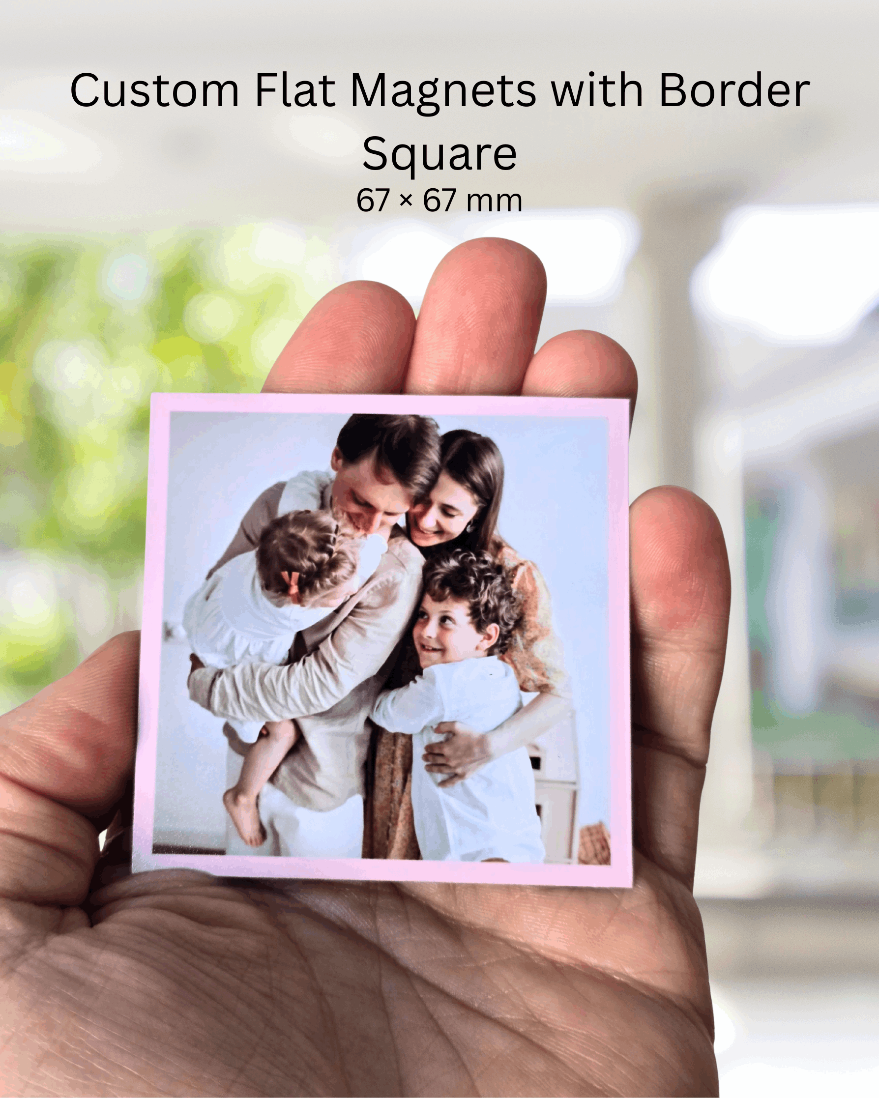 Custom square photo magnet with coloured border, 67x67mm size, held in hand to show scale.