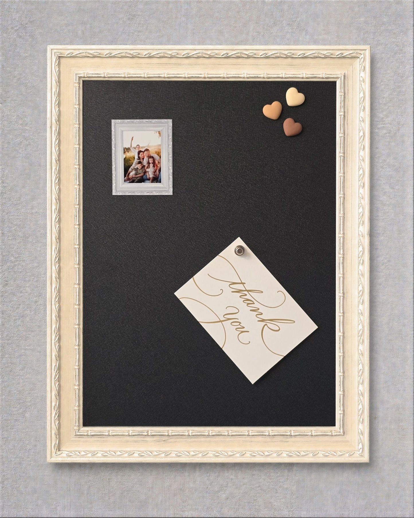 Ivory vintage framed magnet board with a dark graphite magnetic steel surface, shown with a photo, note, and heart magnets attached.