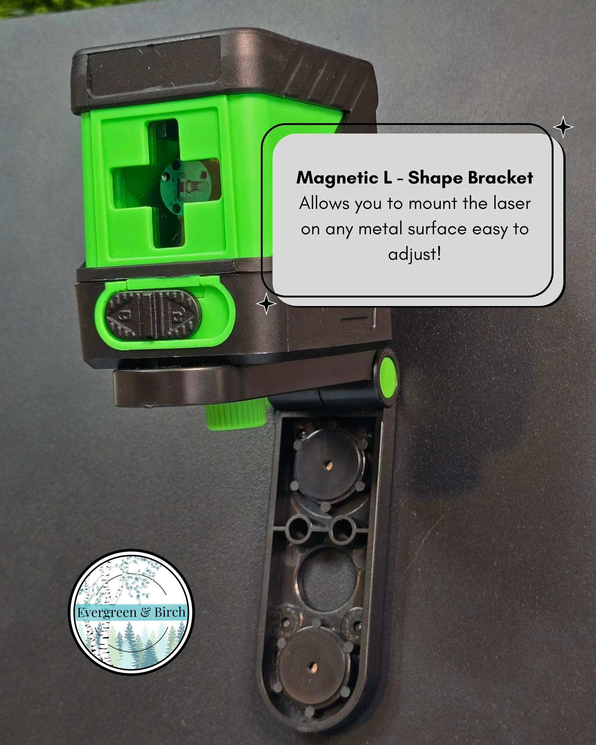 Green self-leveling laser level mounted on magnetic L-shape bracket attached to metal surface for easy gallery wall alignment.