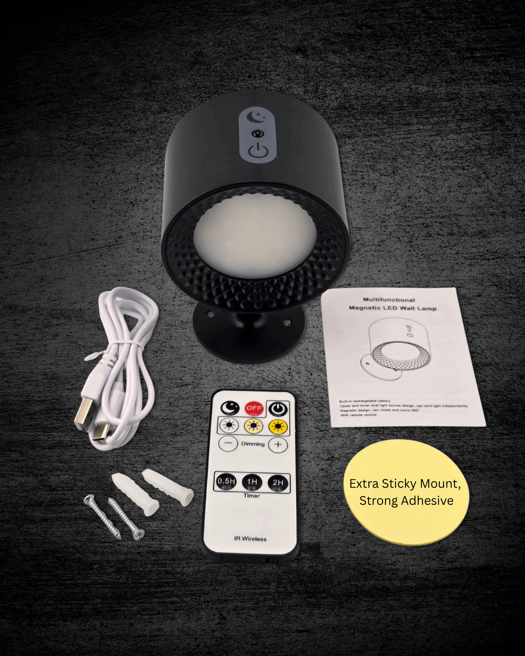 Black LED night light with remote control, cable, and adhesive pad on a dark surface