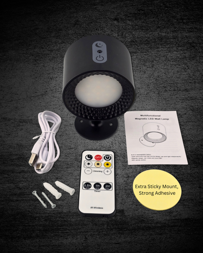 Black LED night light with remote control, cable, and adhesive pad on a dark surface