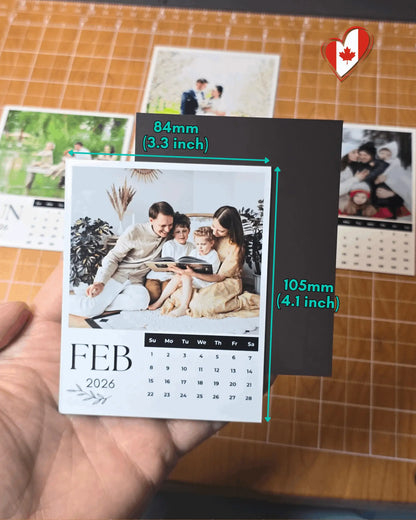 Hand holding 2026 personalized magnetic photo calendar showing 84mm x 105mm size.