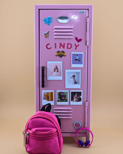 Personalized pink mini retro metal locker with name and photo magnets, styled as a kids desk organizer with mini backpack.