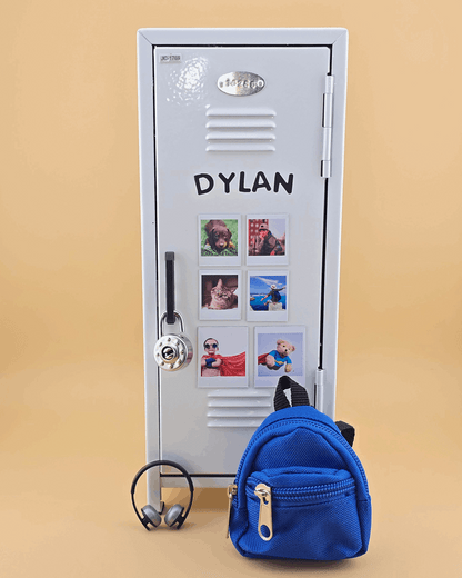 Personalized white mini retro metal locker with name and photo magnets, styled as a kids desk organizer with blue mini backpack.