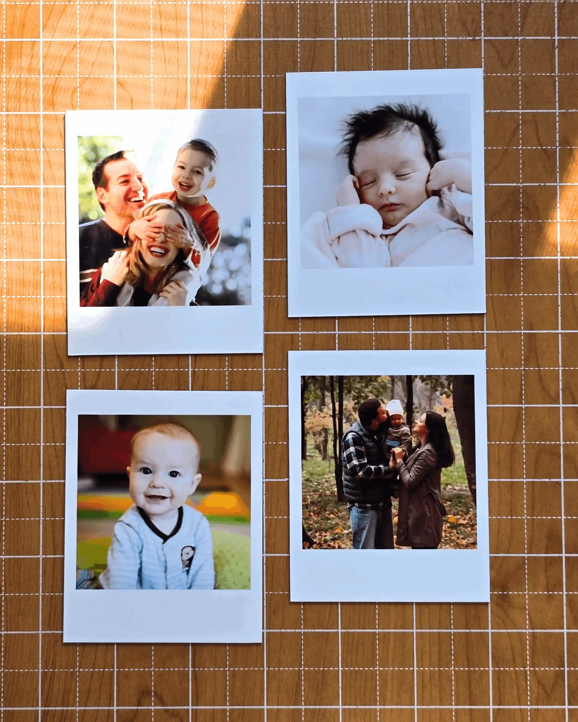 Vintage instant-style custom photo magnets arranged on wooden surface, showing classic retro white border design.